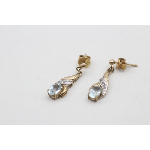 121 - 9ct gold diamond and blue topaz set drop earrings (2g)