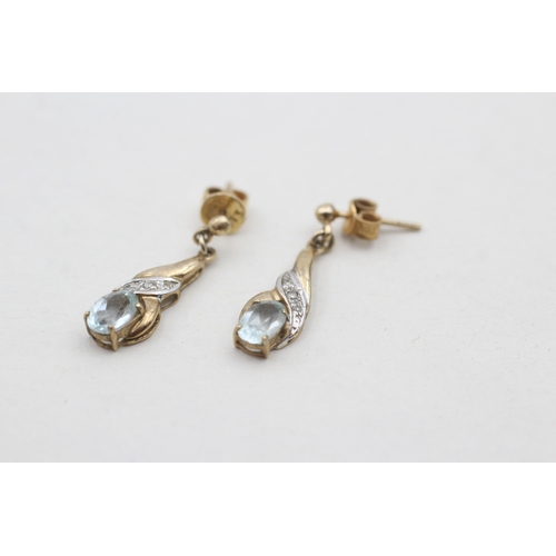 121 - 9ct gold diamond and blue topaz set drop earrings (2g)