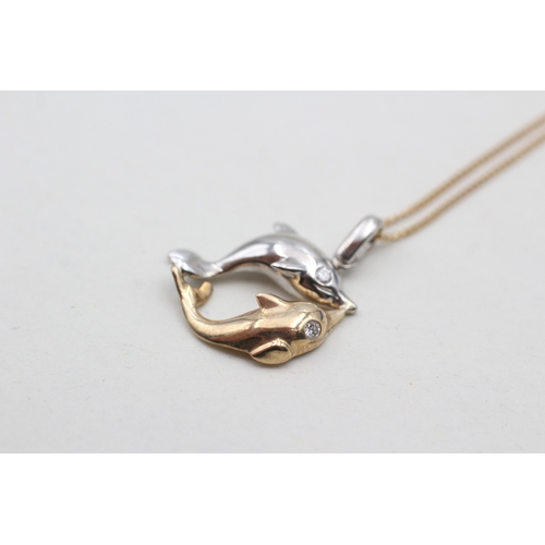 17 - 9ct white and yellow gold diamond set double dolphin pendant necklace (3.6g)