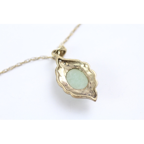 23 - 9ct gold diamond and jade framed pendant on chain (2.7g)