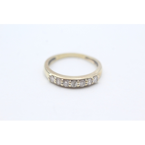 28 - 9ct gold seven stone eternity ring (1.6g) Size K