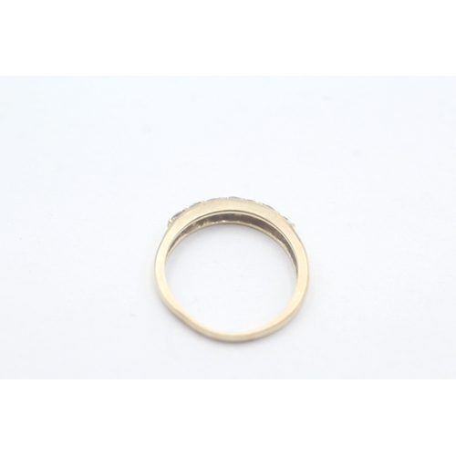 28 - 9ct gold seven stone eternity ring (1.6g) Size K