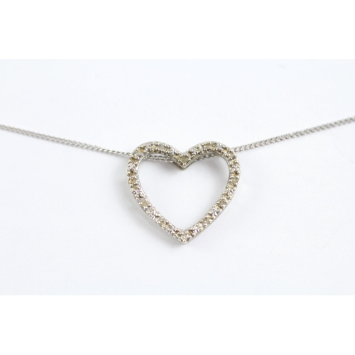 34 - 9ct gold diamond heart pendant on chain (1.4g)