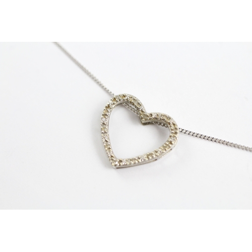 34 - 9ct gold diamond heart pendant on chain (1.4g)