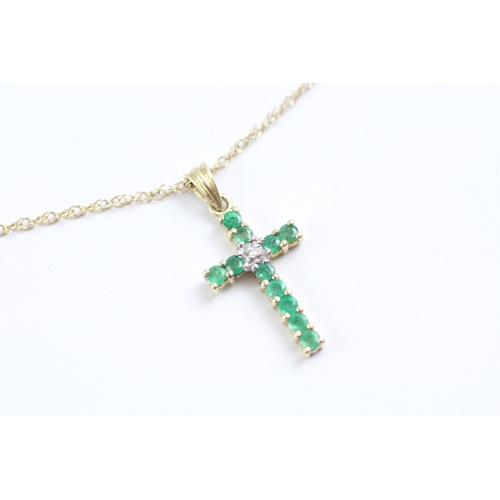 36 - 9ct gold emerald and diamond cross pendant on chain (1.7g)