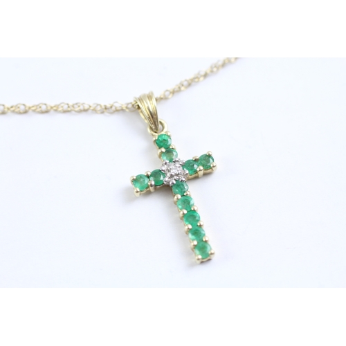 36 - 9ct gold emerald and diamond cross pendant on chain (1.7g)