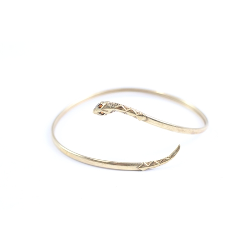 5 - 9ct gold garnet eyed snake bangle (4.9g)