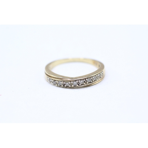 56 - 9ct gold diamond row set ring (1.7g) Size J 1/2