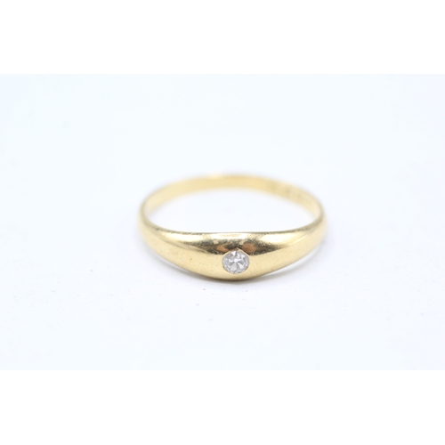 57 - 18ct gold flush set solitaire diamond ring (2.6g) Size P