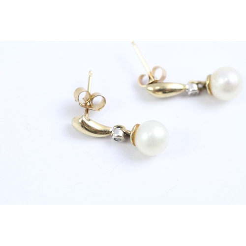 62 - 9ct gold diamond and cultured pearl drop earrings (1.8g)