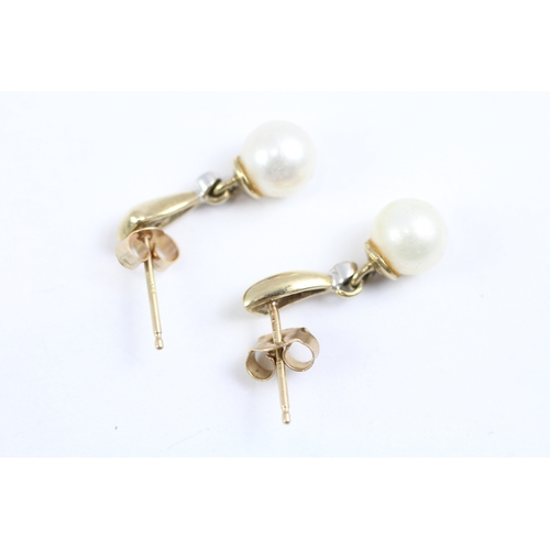 62 - 9ct gold diamond and cultured pearl drop earrings (1.8g)