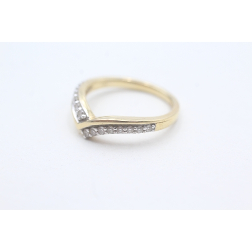 65 - 18ct gold diamond set wishbone ring (3.7g) Size M