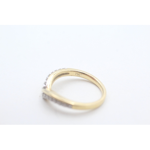 65 - 18ct gold diamond set wishbone ring (3.7g) Size M