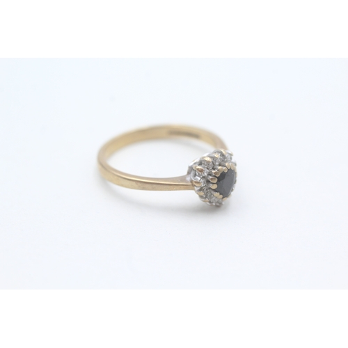 83 - 9ct gold diamond and heart cut sapphire set ring (2.6g) Size O