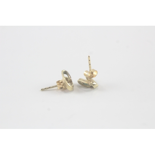 86 - 9ct gold diamond twist ribbon earrings (1g)