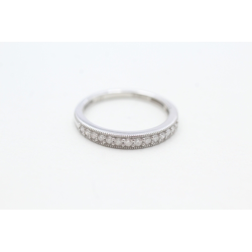 91 - 9ct white gold diamond set 14 stone eternity ring (1.8g) Size L