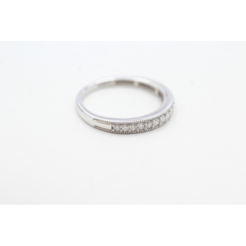 91 - 9ct white gold diamond set 14 stone eternity ring (1.8g) Size L