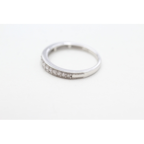 91 - 9ct white gold diamond set 14 stone eternity ring (1.8g) Size L