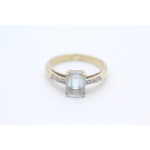 92 - 9ct gold diamond accented aquamarine set dress ring (3.4g) Size N 1/2