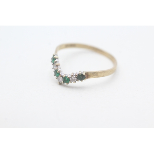 96 - 9ct gold diamond and emerald set wishbone ring (1.2g) Size P