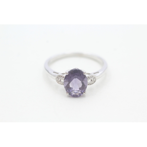 97 - 9ct white gold diamond and amethyst set dress ring (2.4g) Size T