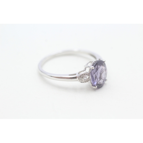 97 - 9ct white gold diamond and amethyst set dress ring (2.4g) Size T