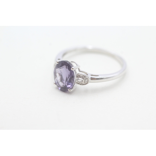 97 - 9ct white gold diamond and amethyst set dress ring (2.4g) Size T