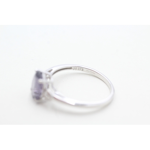 97 - 9ct white gold diamond and amethyst set dress ring (2.4g) Size T