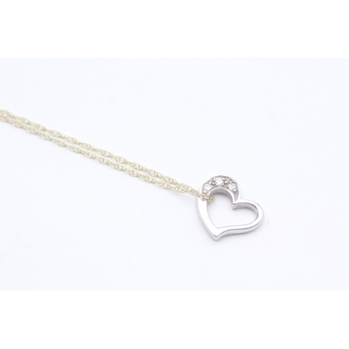 108 - 9ct gold diamond heart pendant on chain (1.7g)