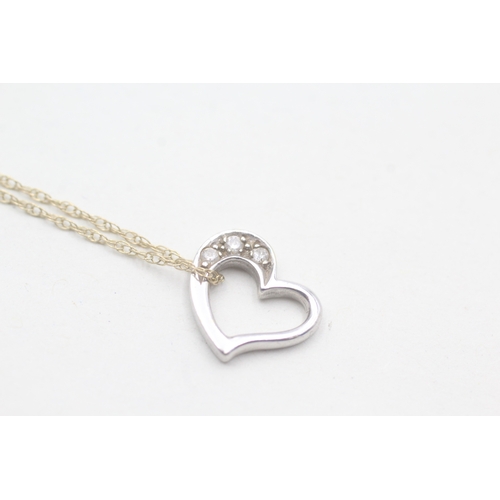 108 - 9ct gold diamond heart pendant on chain (1.7g)