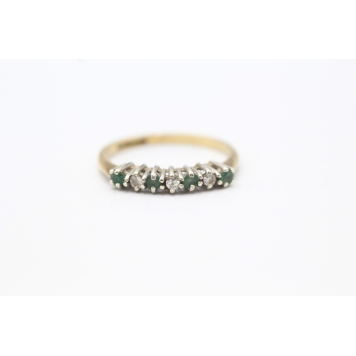 111 - 9ct gold emerald and diamond set seven stone eternity ring (1.6g) Size N 1/2