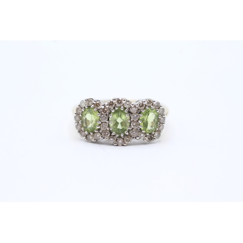 135 - 9ct gold peridot & diamond dress ring (3.4g) Size N