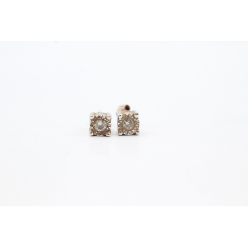 141 - 9ct gold diamond stud earrings (0.9g)