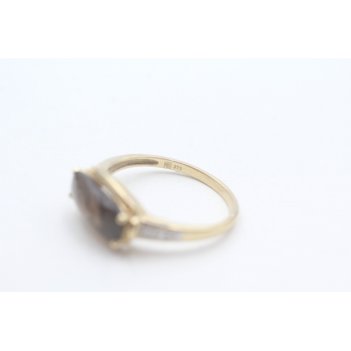 178 - 9ct gold faceted smokey quartz & diamond dress ring (2.6g) Size T