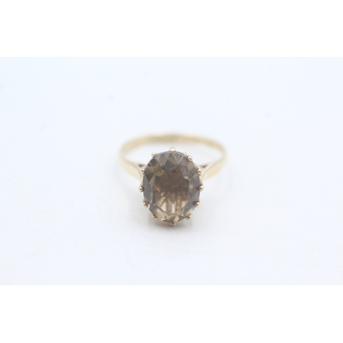 193 - 9ct gold oval cut smokey quartz dress ring (2.1g) Size J 1/2