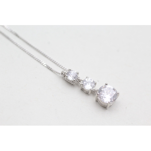 209 - 14ct white gold clear gemstone three stone drop pendant on chain (2.3g)