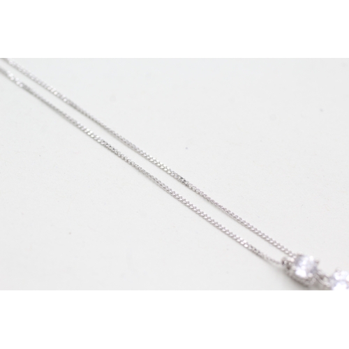 209 - 14ct white gold clear gemstone three stone drop pendant on chain (2.3g)