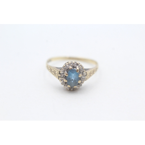 215 - 9ct gold blue gemstone & diamond cluster ring with patterned shoulders (1.6g) Size L