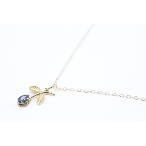 229 - 9ct gold sapphire floral pendant necklace (0.8g)