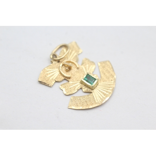 234 - 18ct gold emerald Aztec figure pendant (2.2g)