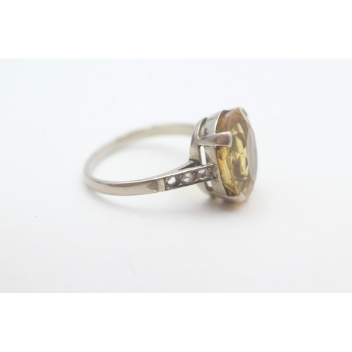 240 - 18ct white gold citrine single stone ring with diamond set shoulders (3.8g) - stone missing Size M