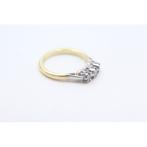 242 - 18ct gold diamond three stone ring (2.6g) Size J