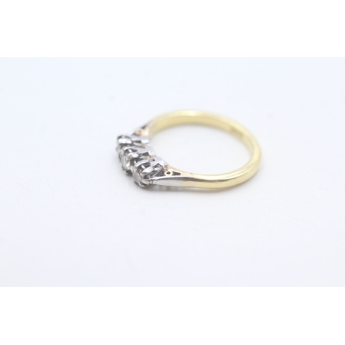 242 - 18ct gold diamond three stone ring (2.6g) Size J