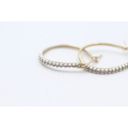 246 - 9ct gold diamond hoop earrings (1.6g)