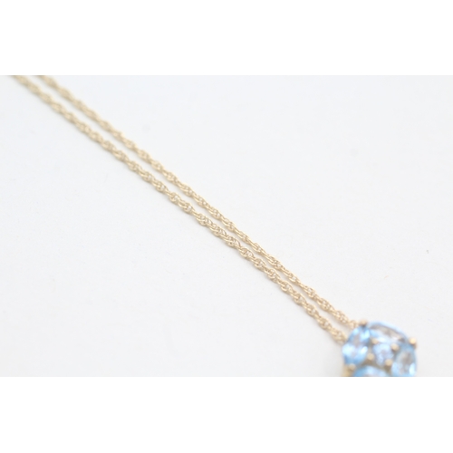 250 - 9ct gold vari-cut blue topaz pendant necklace (1.4g)