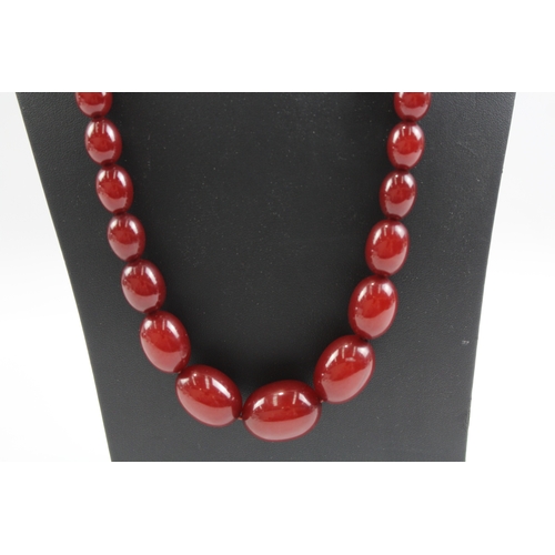 252 - Graduated Cherry Bakelite Necklace w/ Internal Streaking 53g