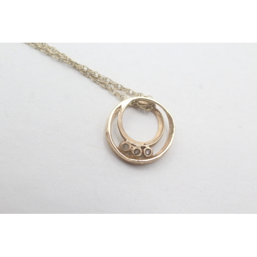 37 - 9ct gold diamond set halo loop pendant necklace (2.2g)