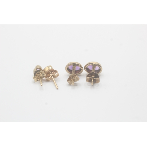 55 - 2x 9ct gold amethyst stud earrings (1.7g)