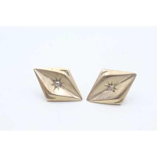 63 - 9ct gold star set diamond  form stud earrings (2g)