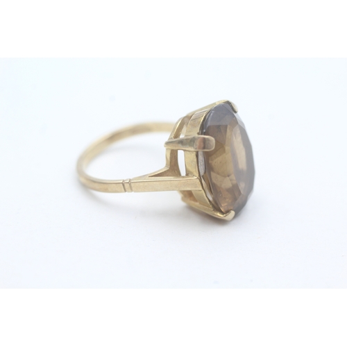 64 - 9ct gold smoky quartz cocktail ring (6.1g) Size N 1/2